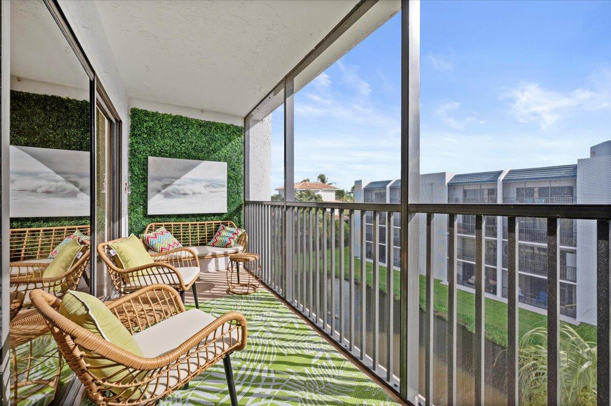 a balcony view with a furniture