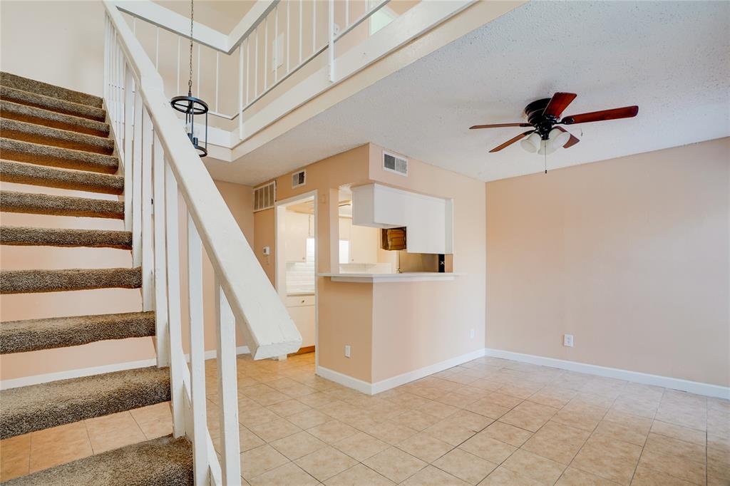 a view of entryway and hall with a chandelier