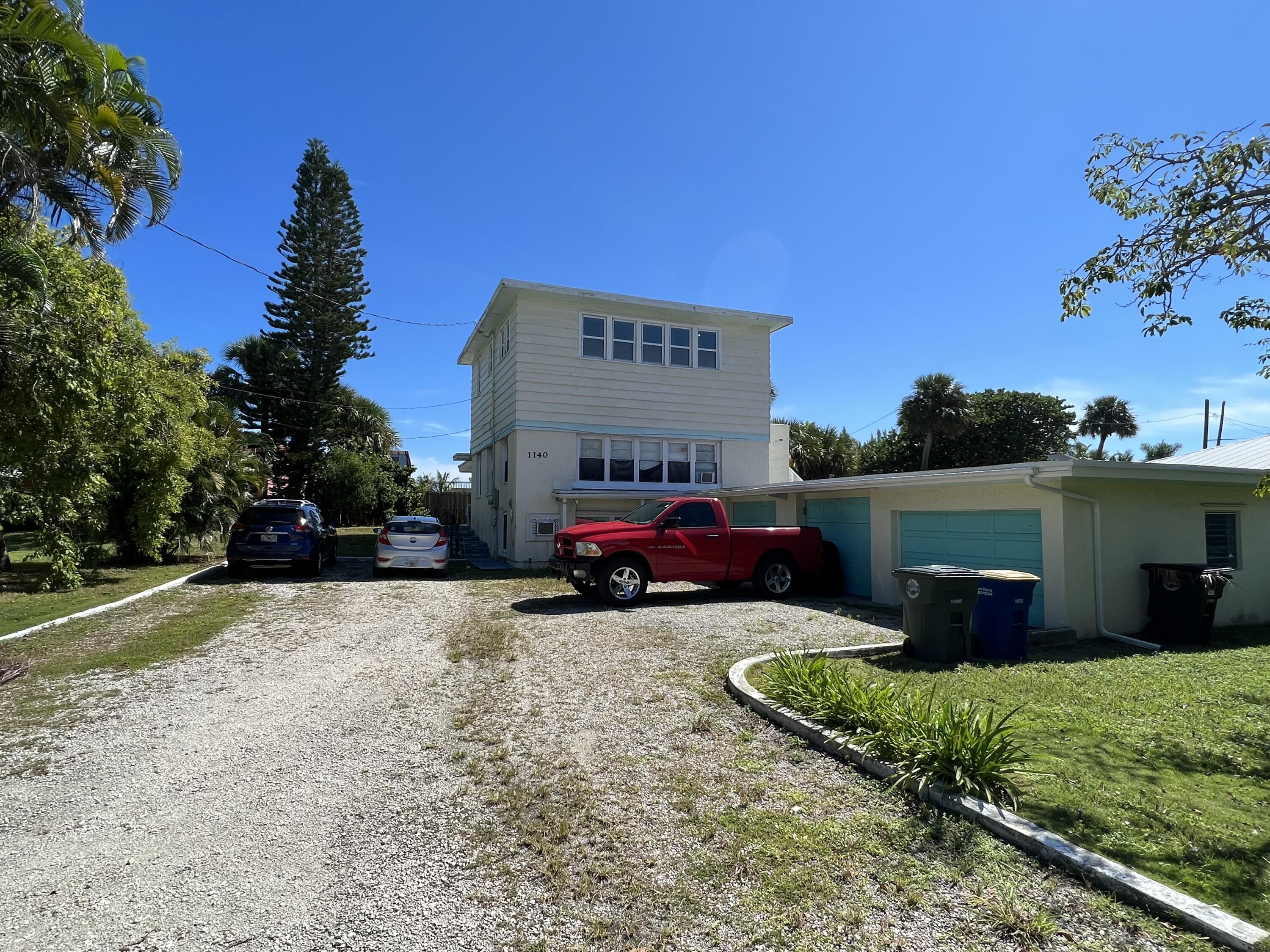 a view of a car park in front of house