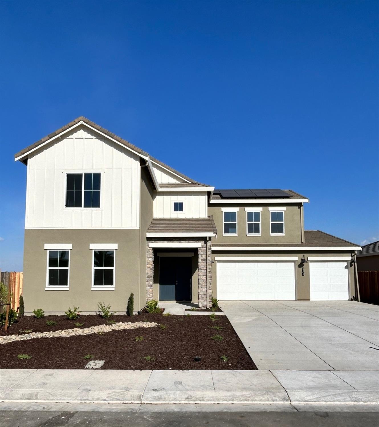 a front view of a house with a garage