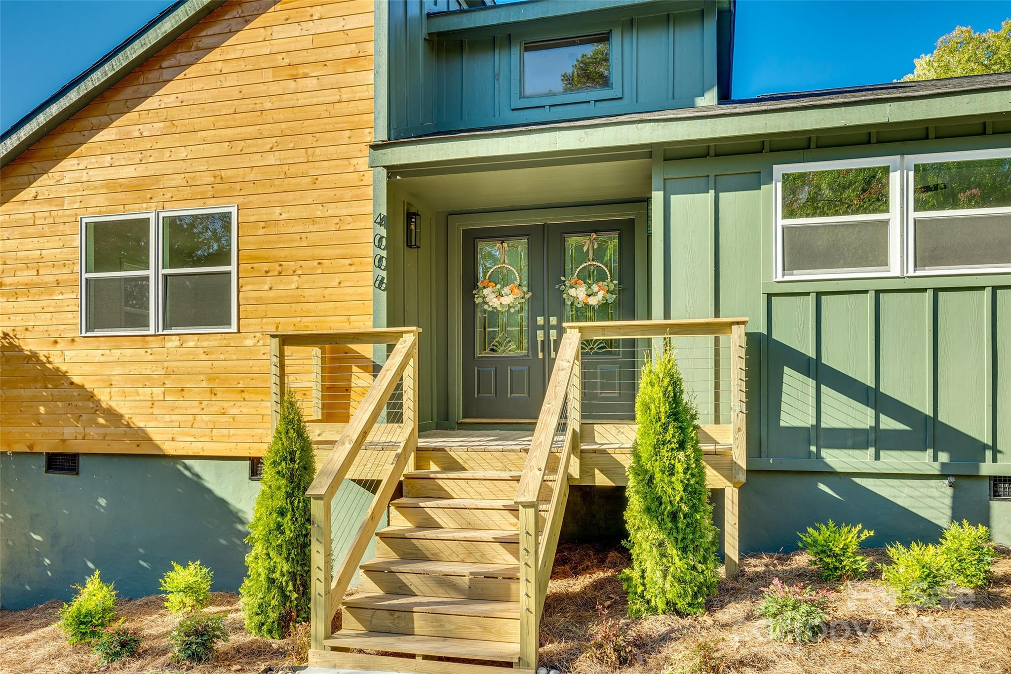 a front view of a house having outdoor seating