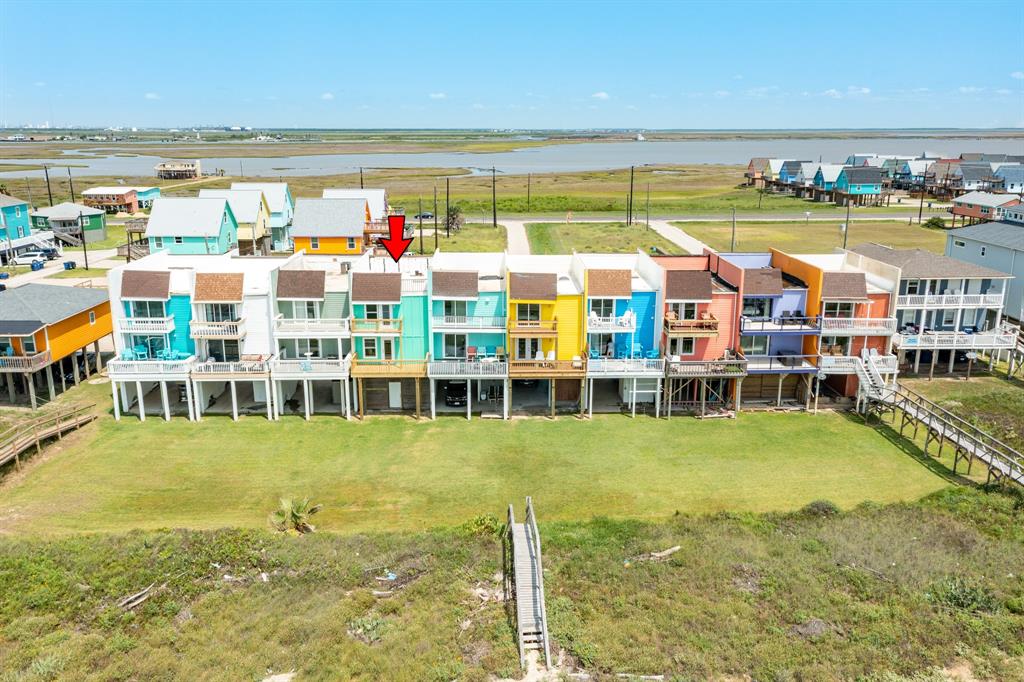 a view of an ocean with a building in the background