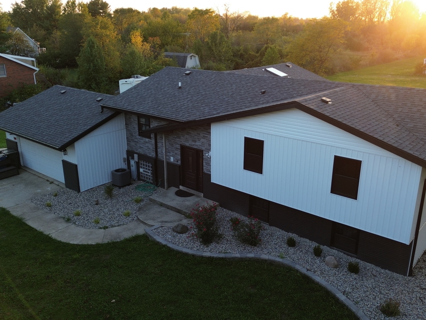 a aerial view of a house with a yard