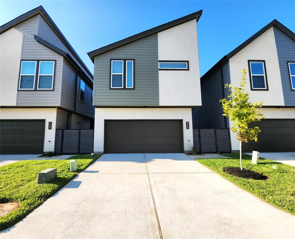 a house that has a big yard in front of it