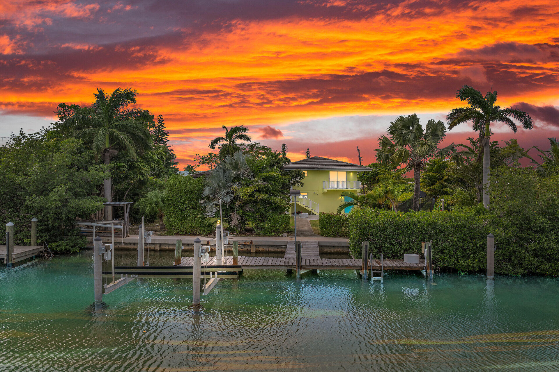 a view of a lake with a house in the background