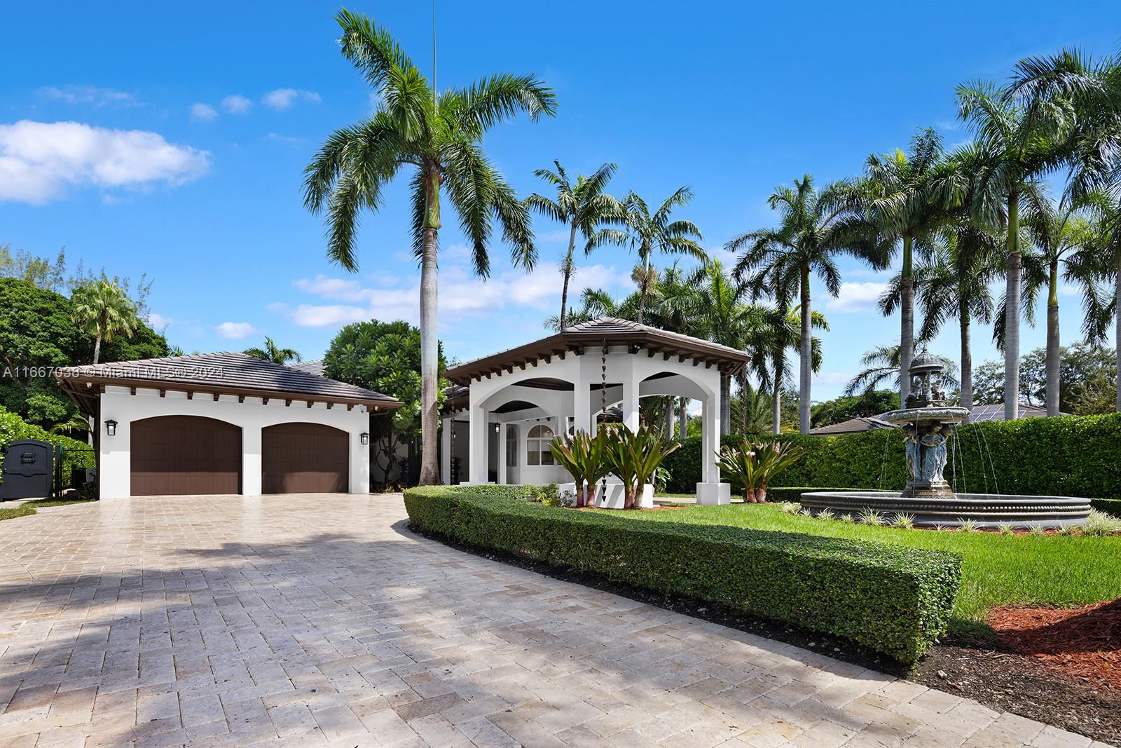 a view of house with outdoor space and palm tree