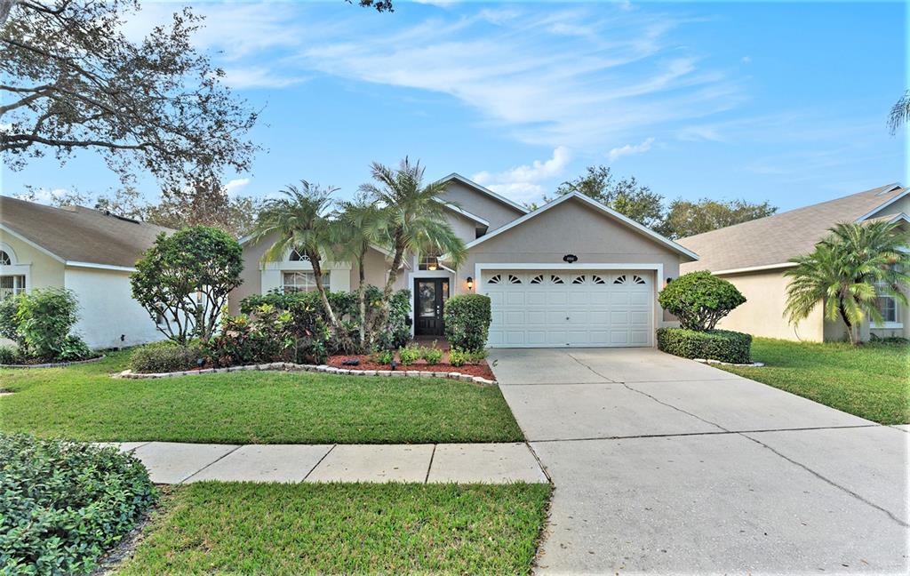 a view of front of house with a yard