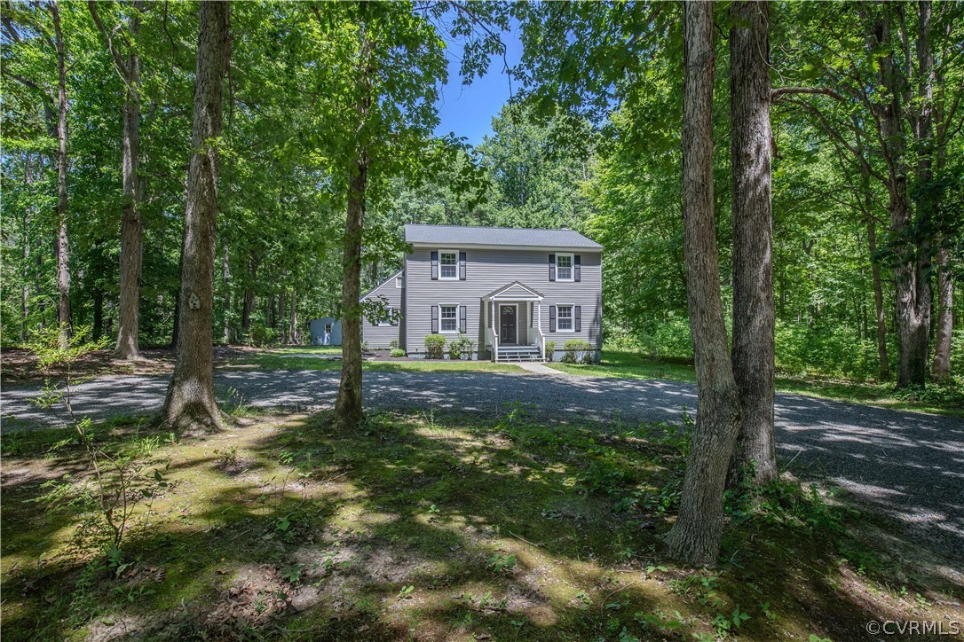 a house with trees in the background