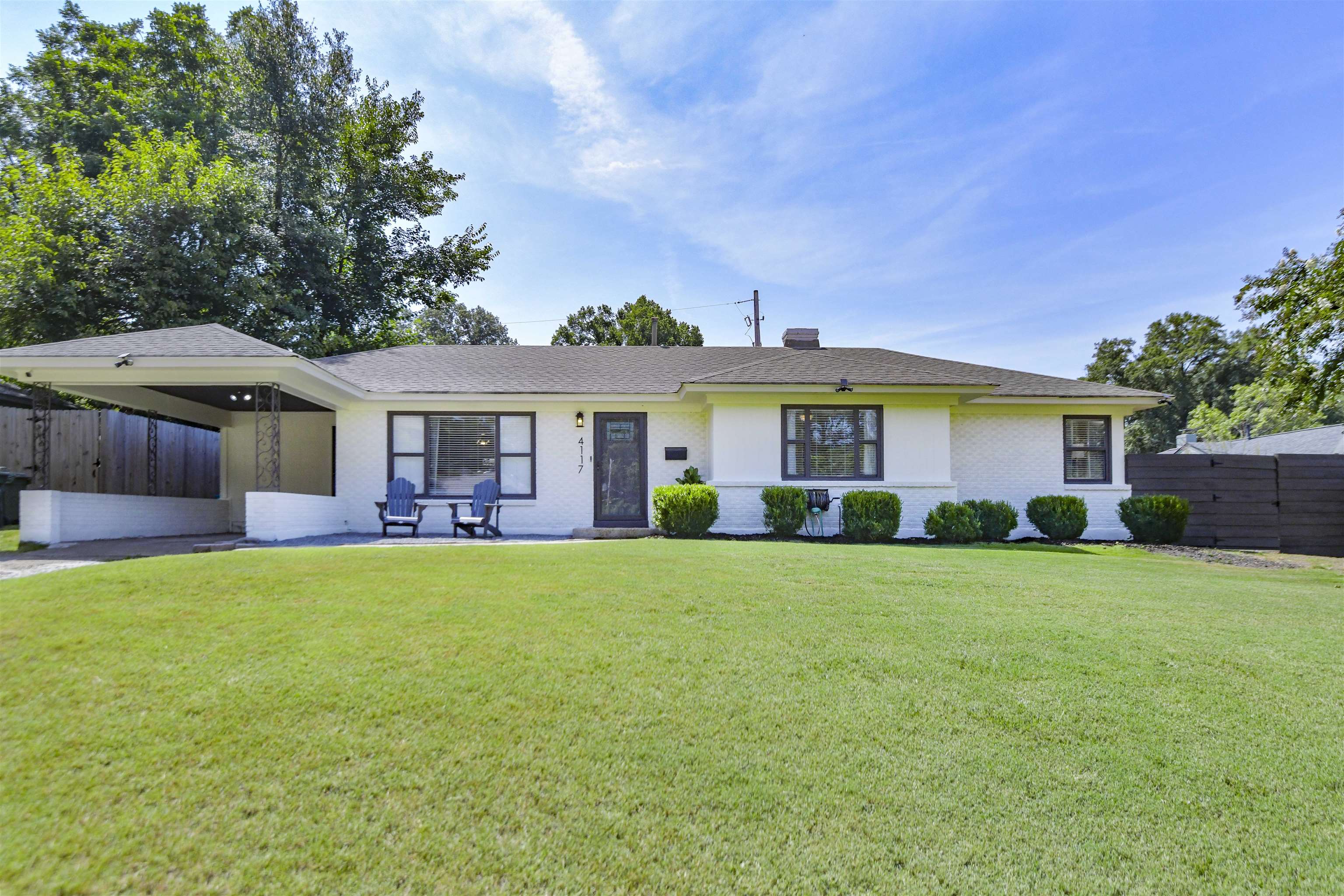 Single story home featuring a front lawn