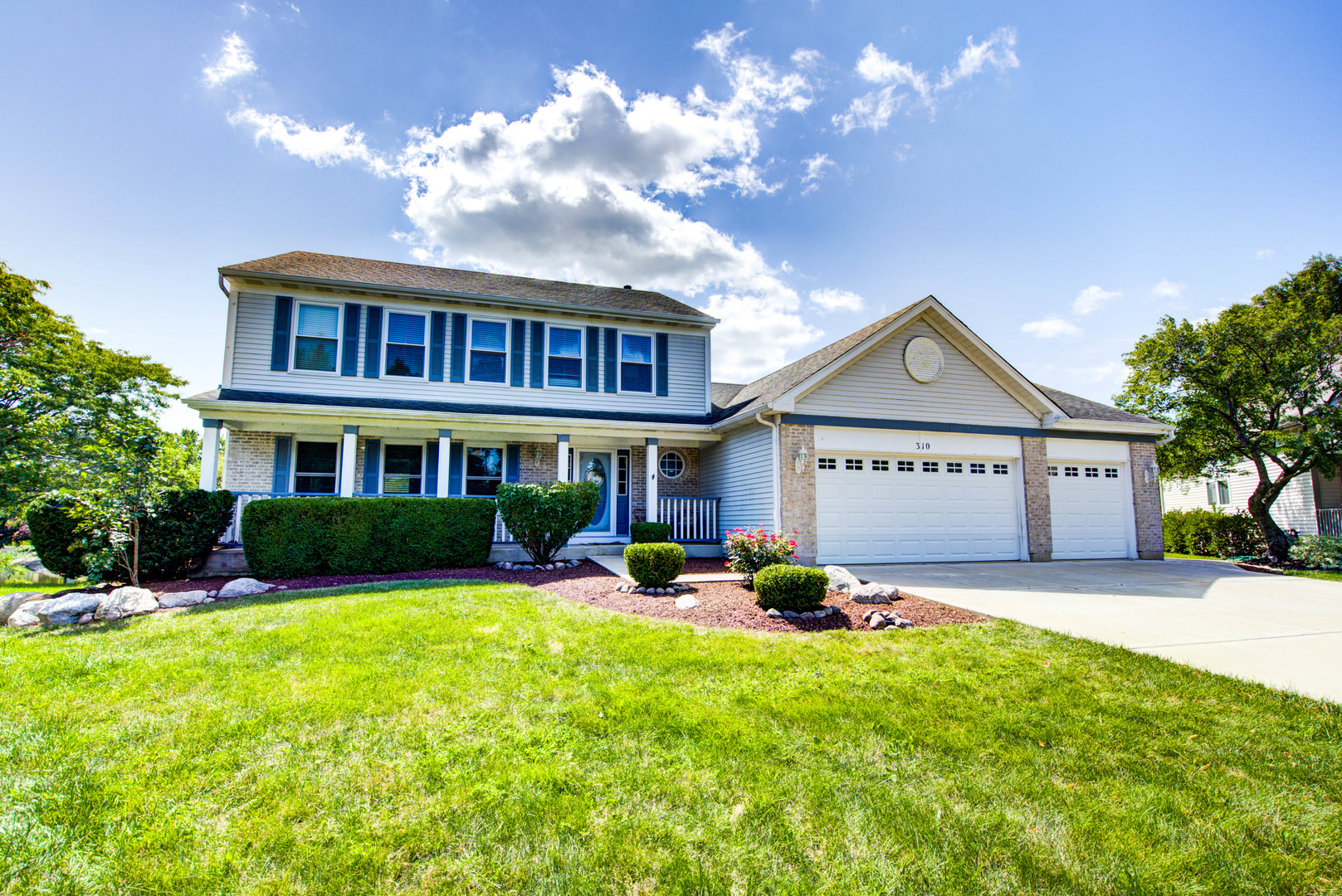 a view of a house with a yard porch and sitting area