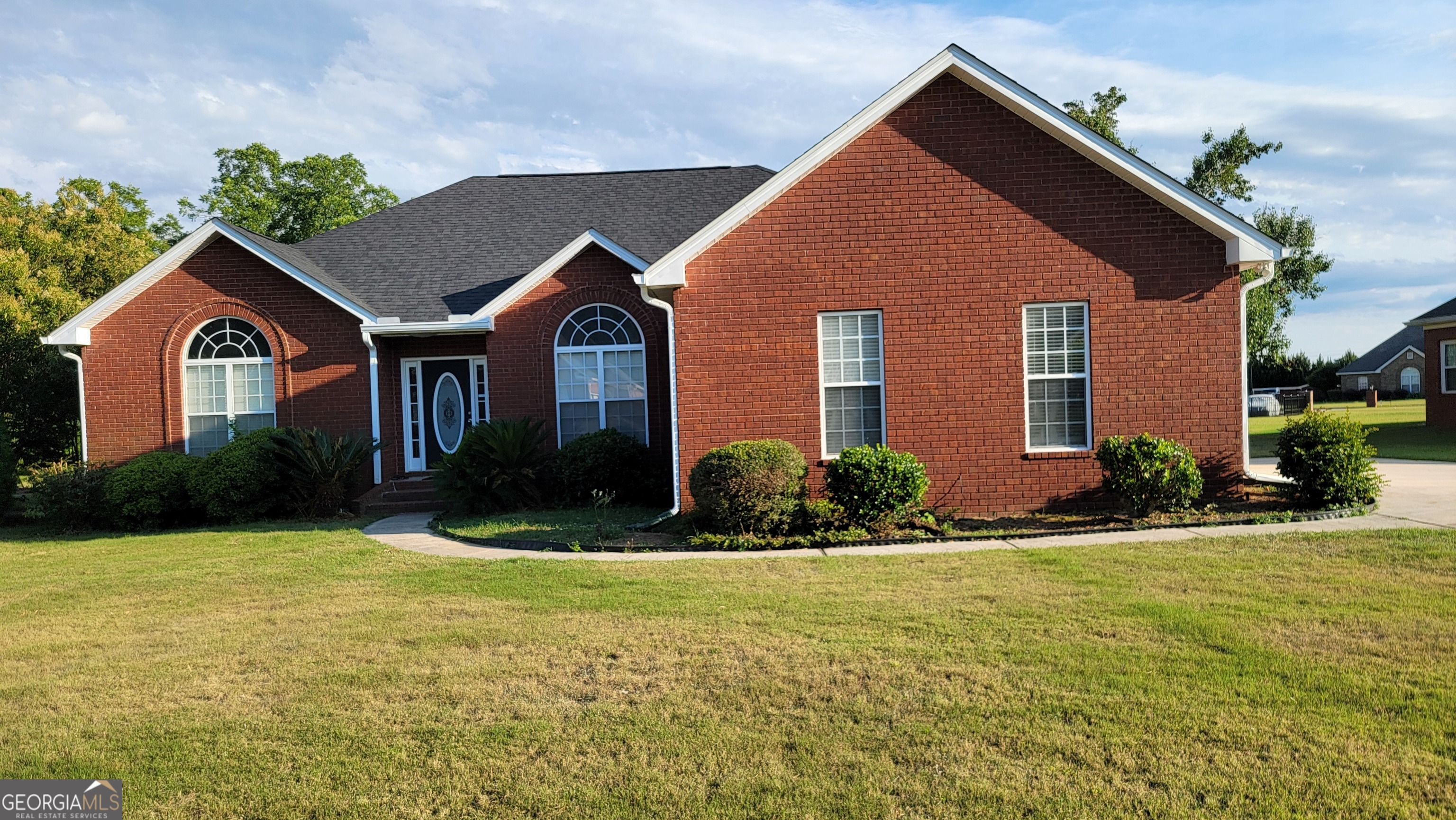 a front view of a house with a yard