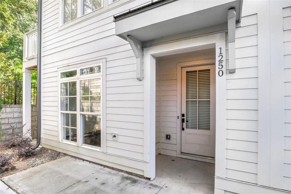 a view of front door and a window