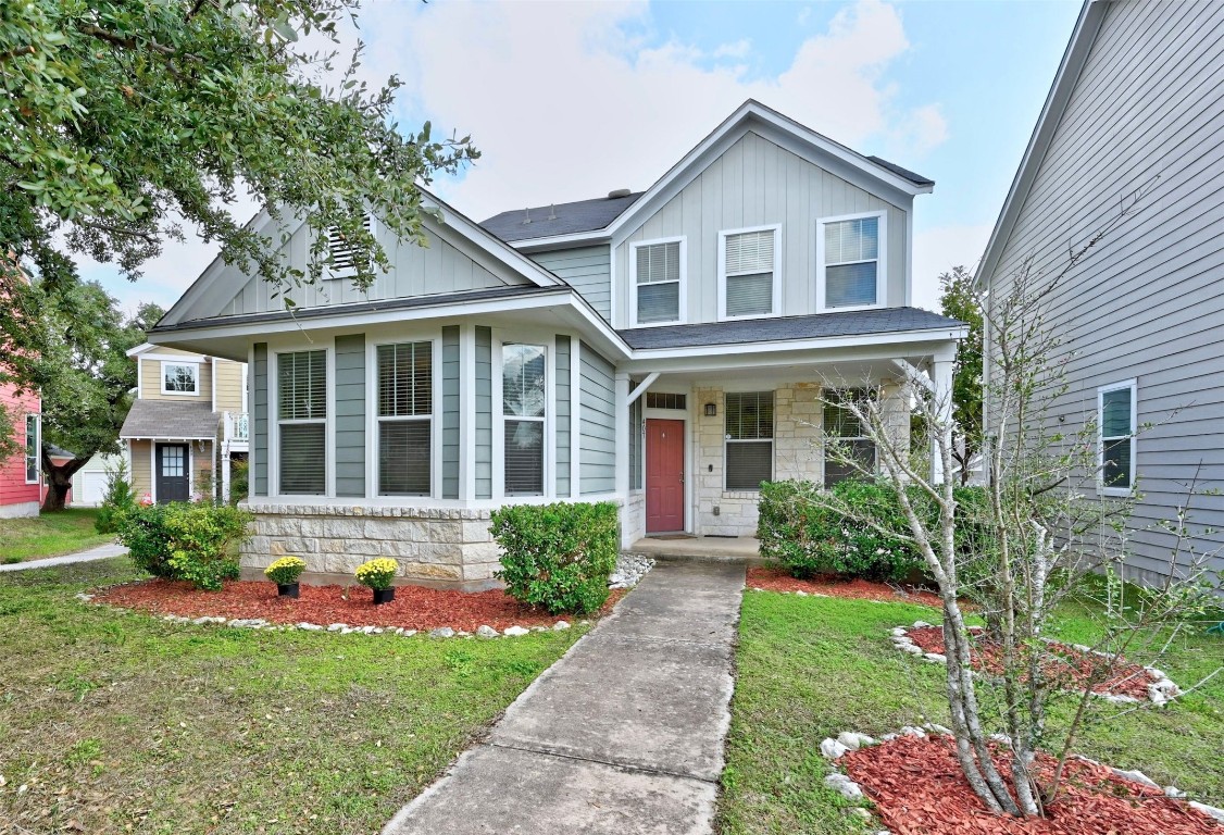 a front view of a house with garden