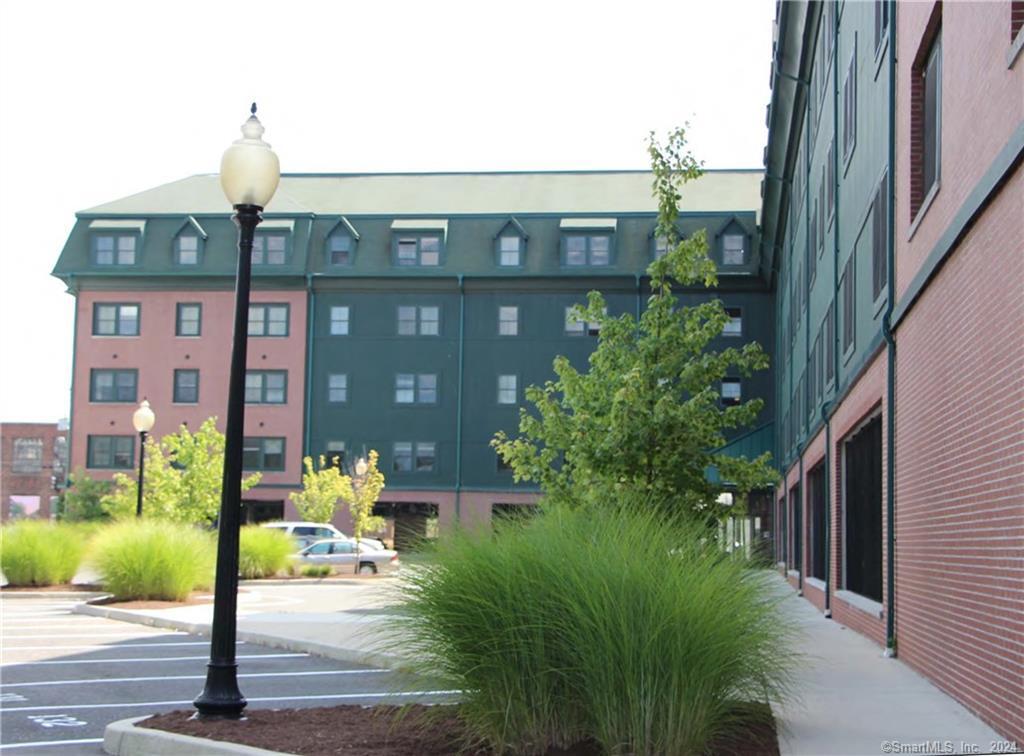 a front view of a building with garden