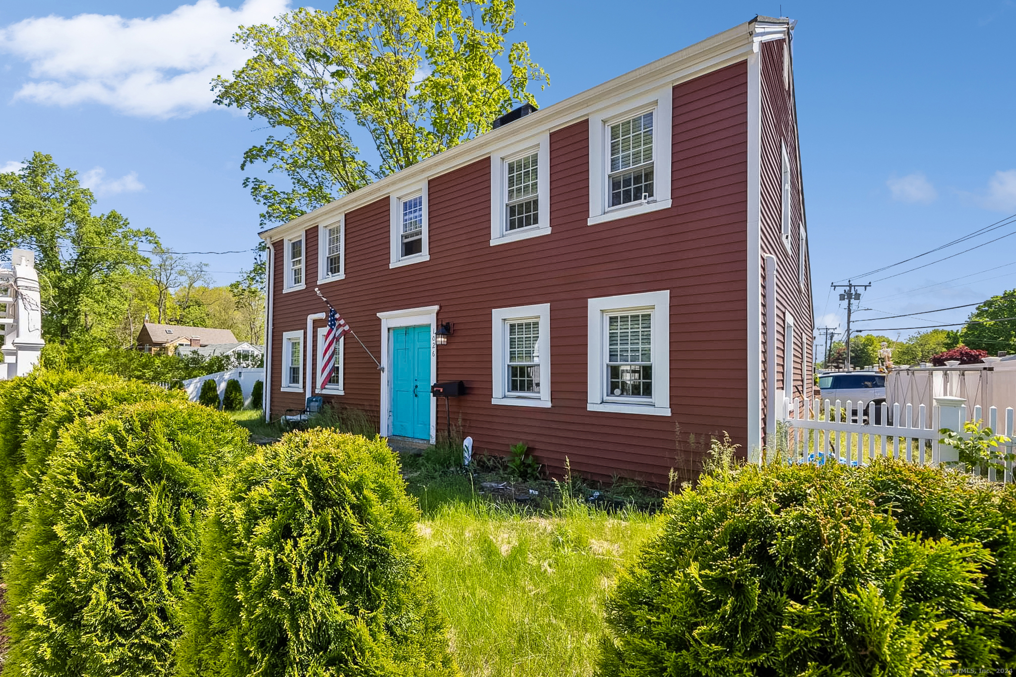 a front view of a house with garden