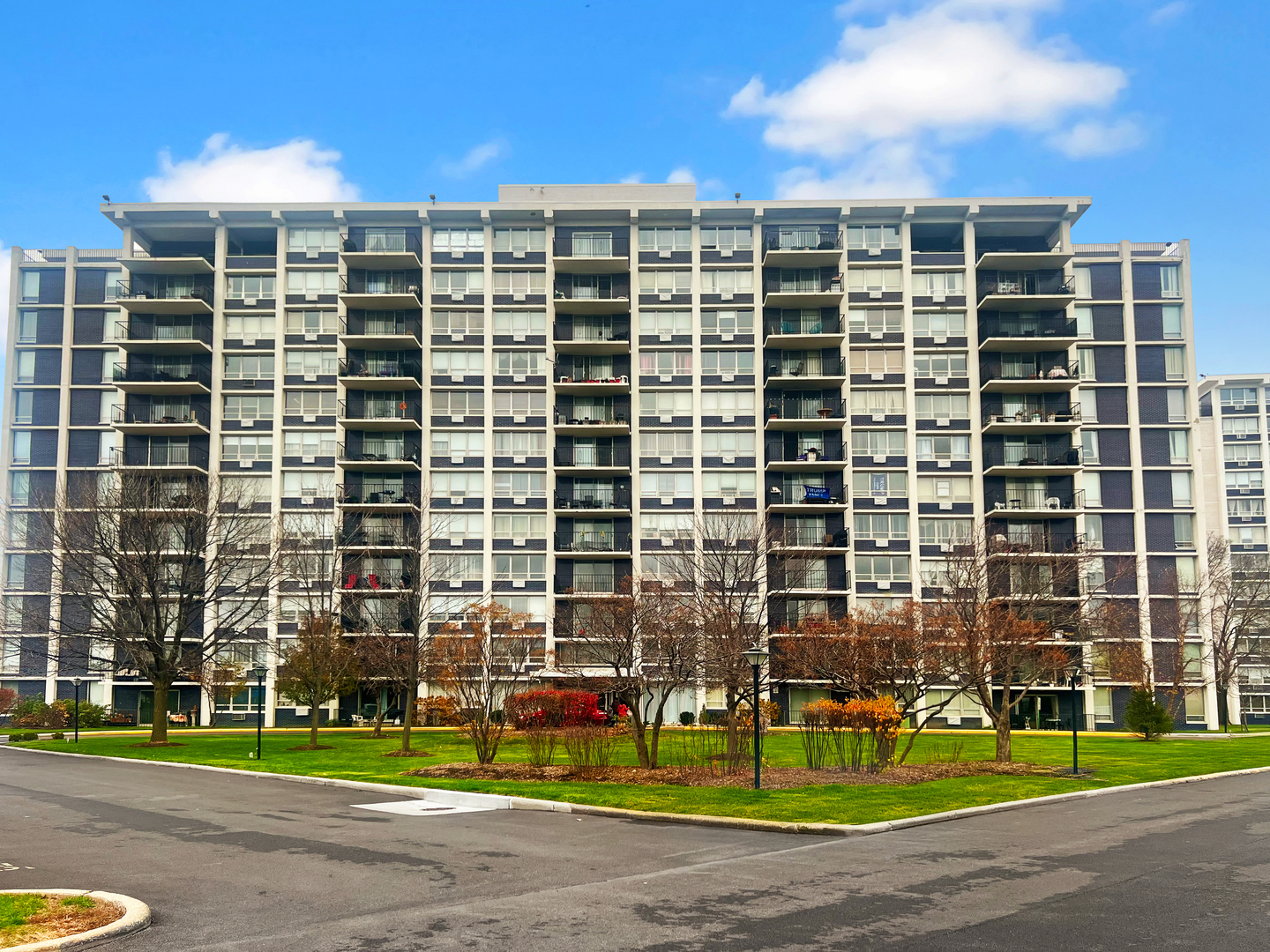 a view of a building with a yard