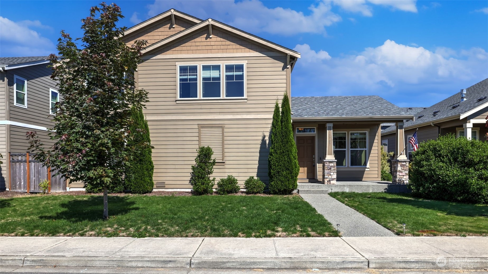 a front view of a house with a yard