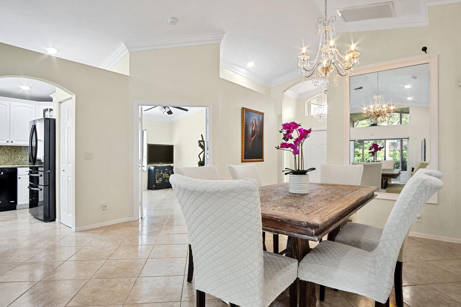 a view of a dining room with furniture and chandelier