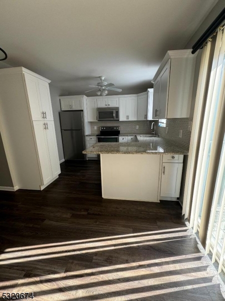 a view of a kitchen from the hallway