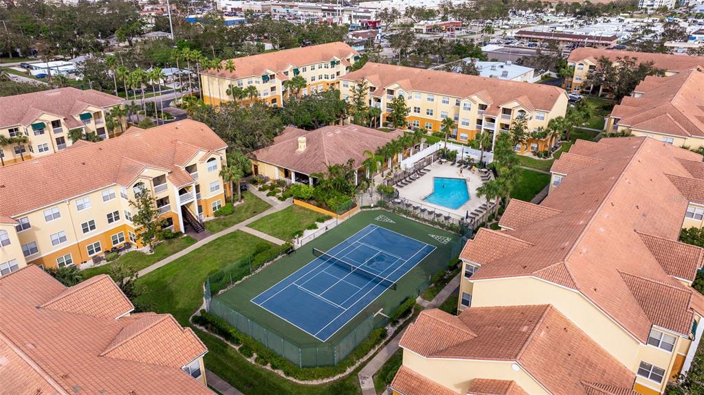 an aerial view of residential houses with outdoor space