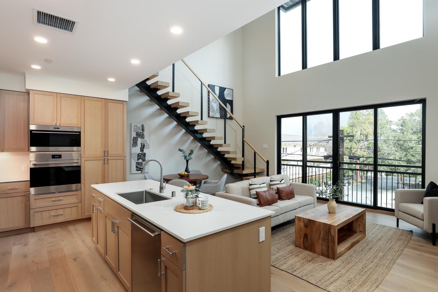 a kitchen with a stove a sink and a refrigerator