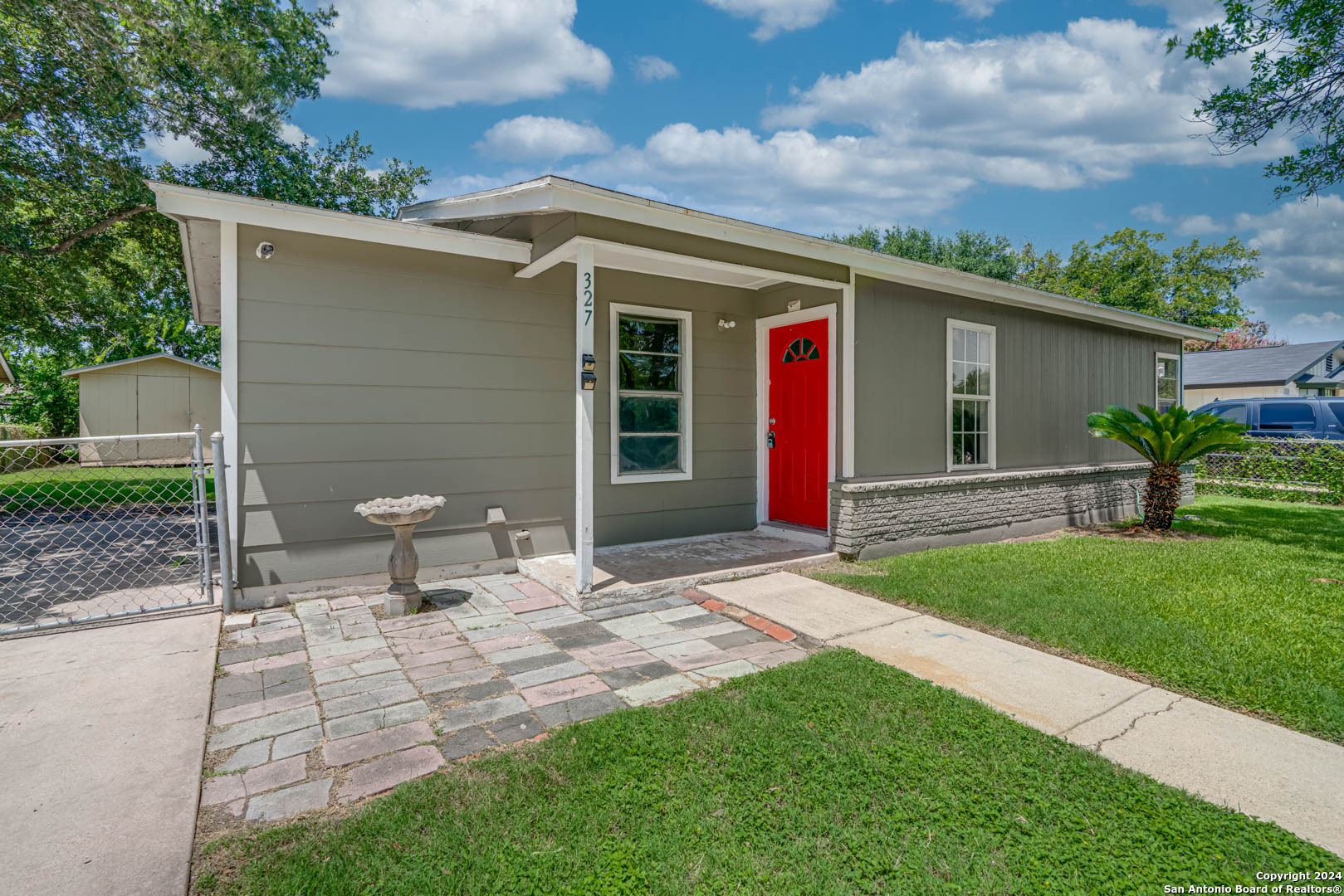 a front view of house with yard and seating