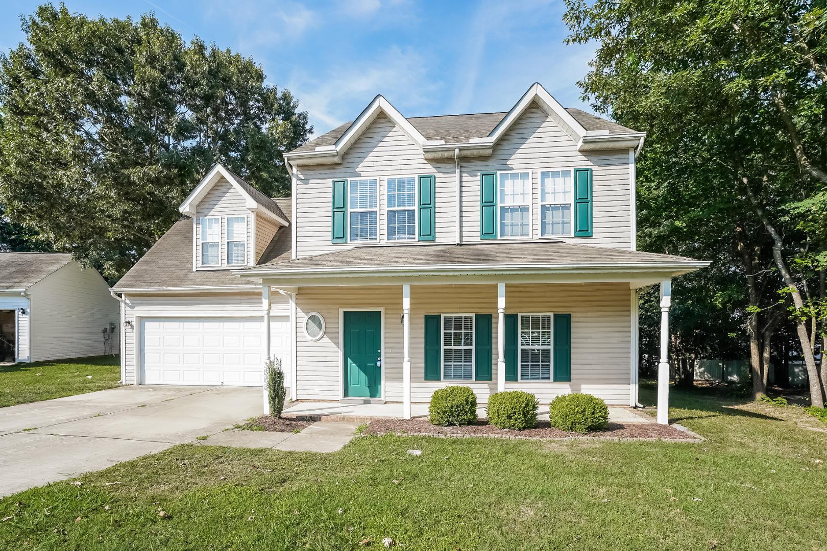 front view of a house with a yard