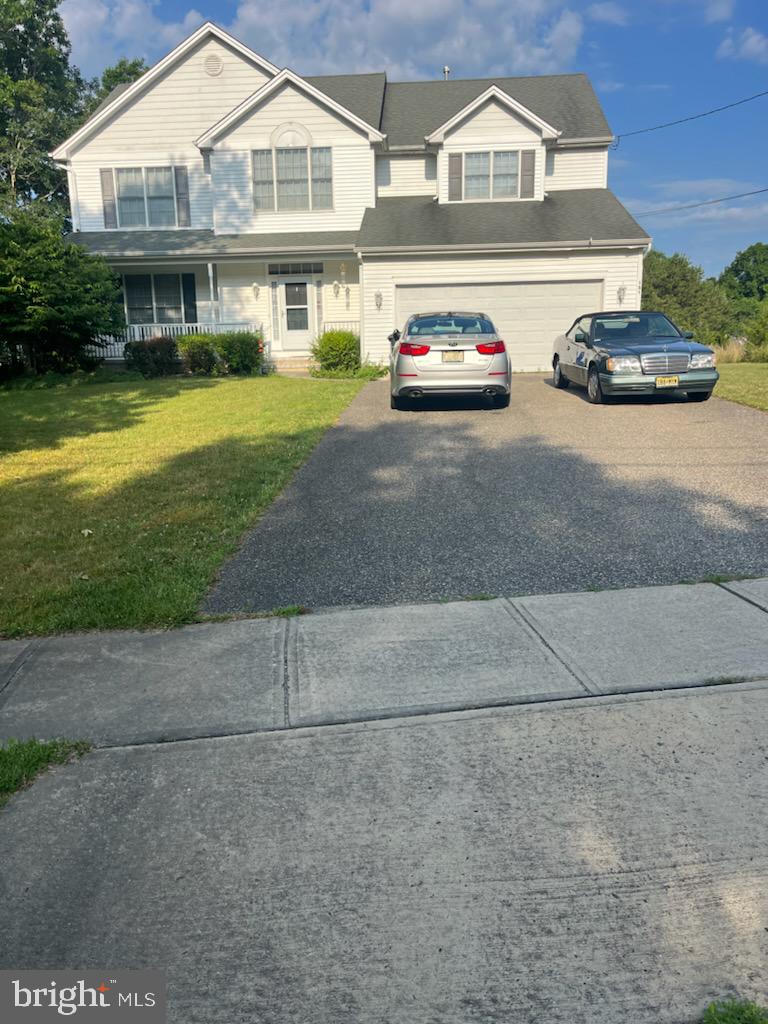 a view of multiple houses with a yard