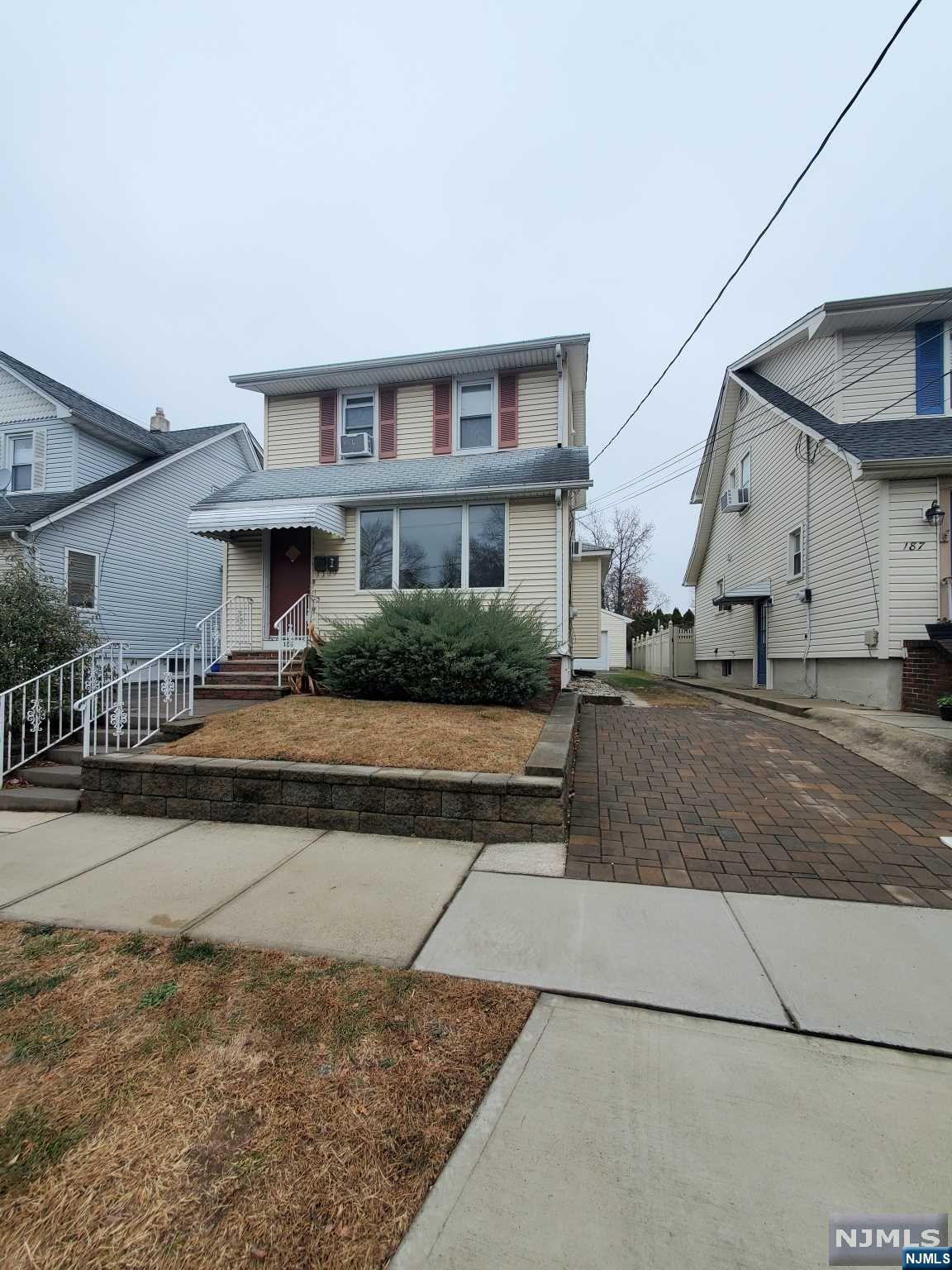 a front view of a house with garage