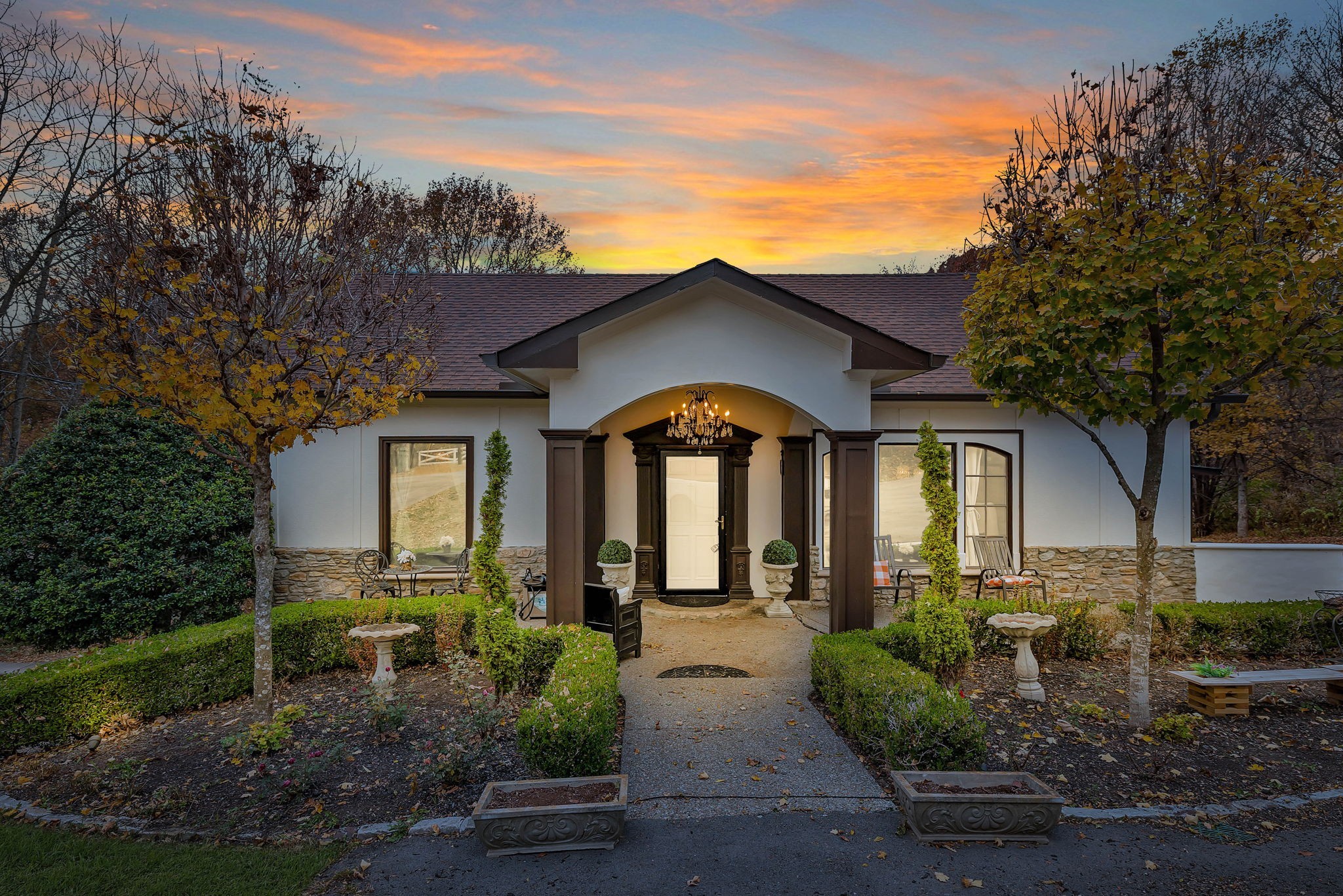 a front view of a house with garden