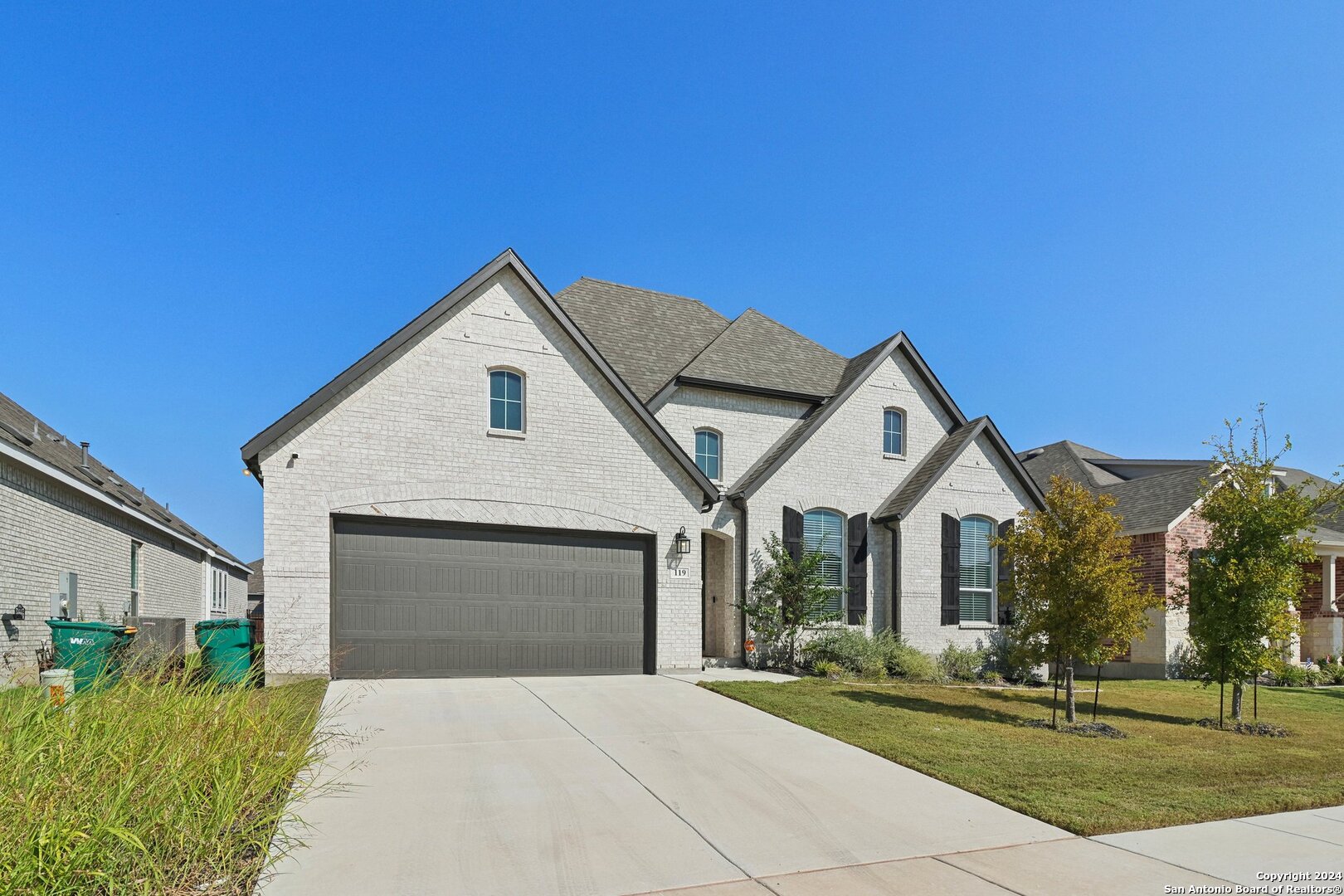 a front view of a house with a yard