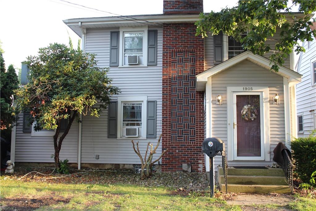 a front view of a house with garage