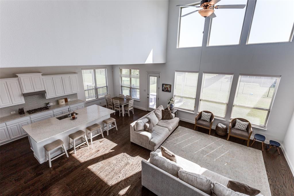 a living room with furniture a rug and a table