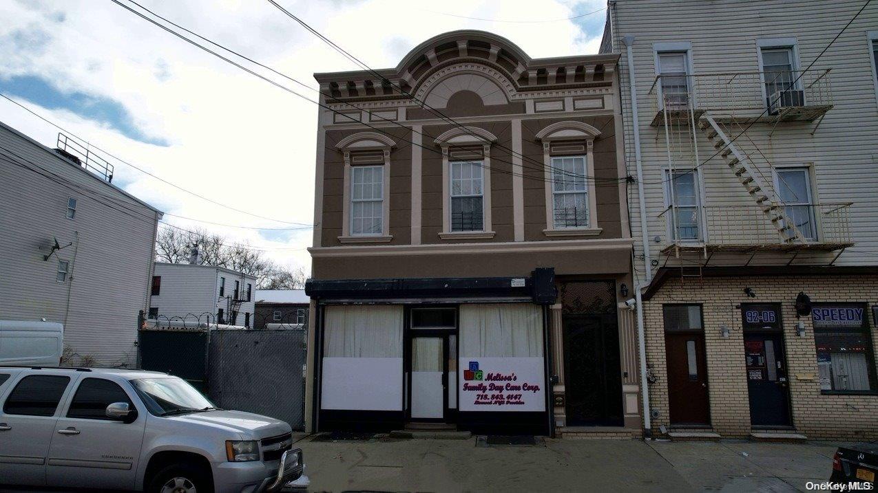 a front view of a house with parking space