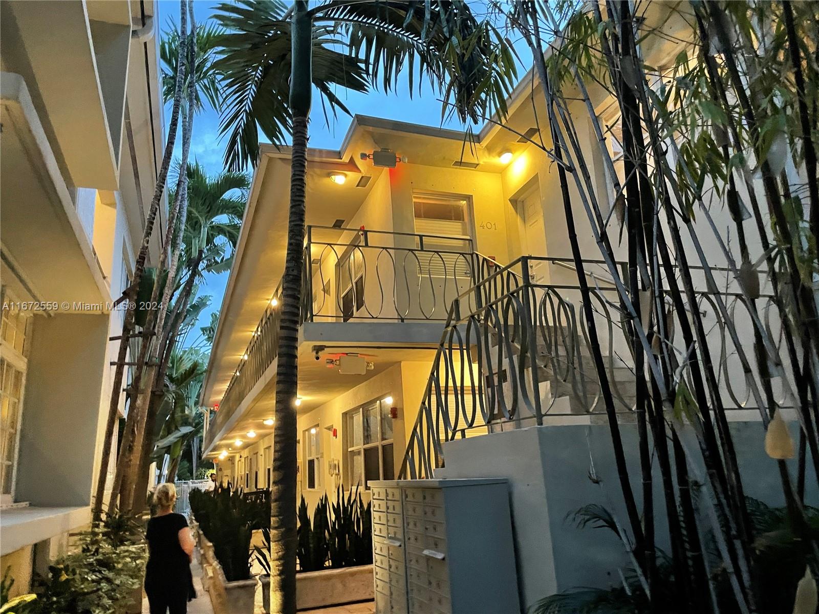 a view of a palm trees in front of a building