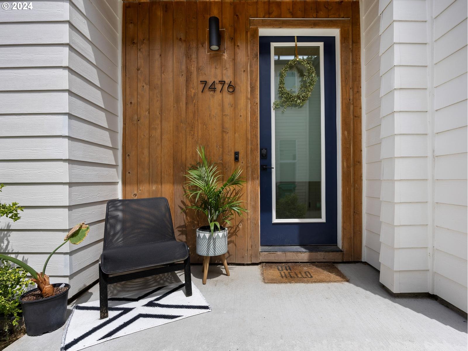 a house view with a outdoor seating space