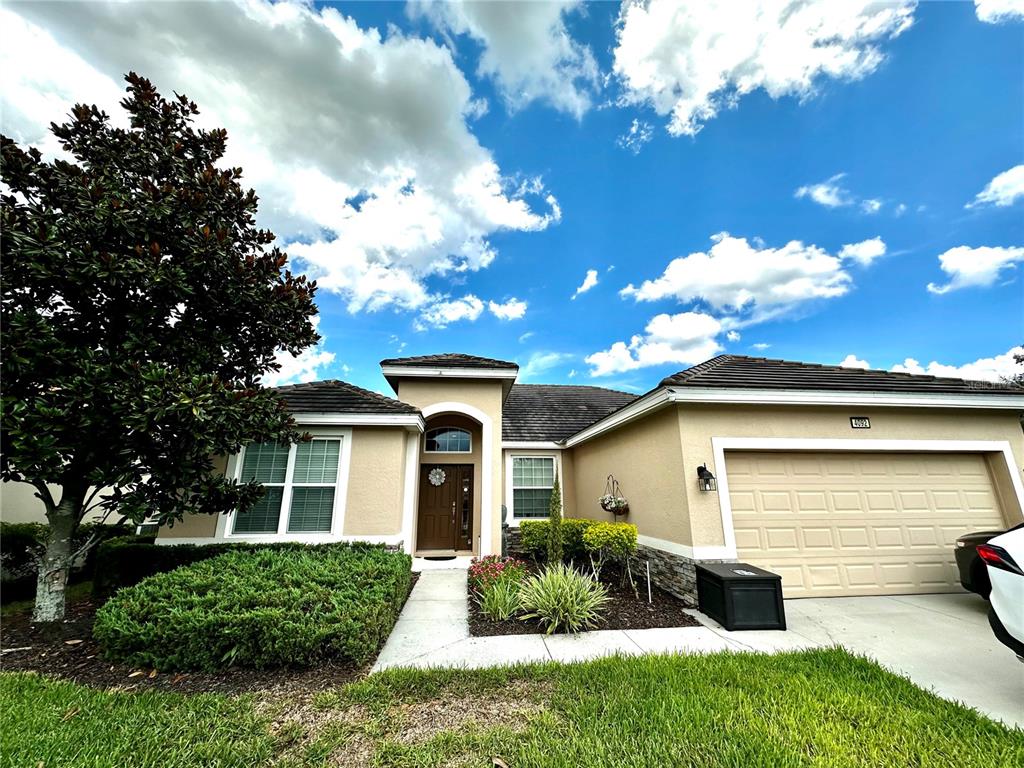 a view of a house with a yard