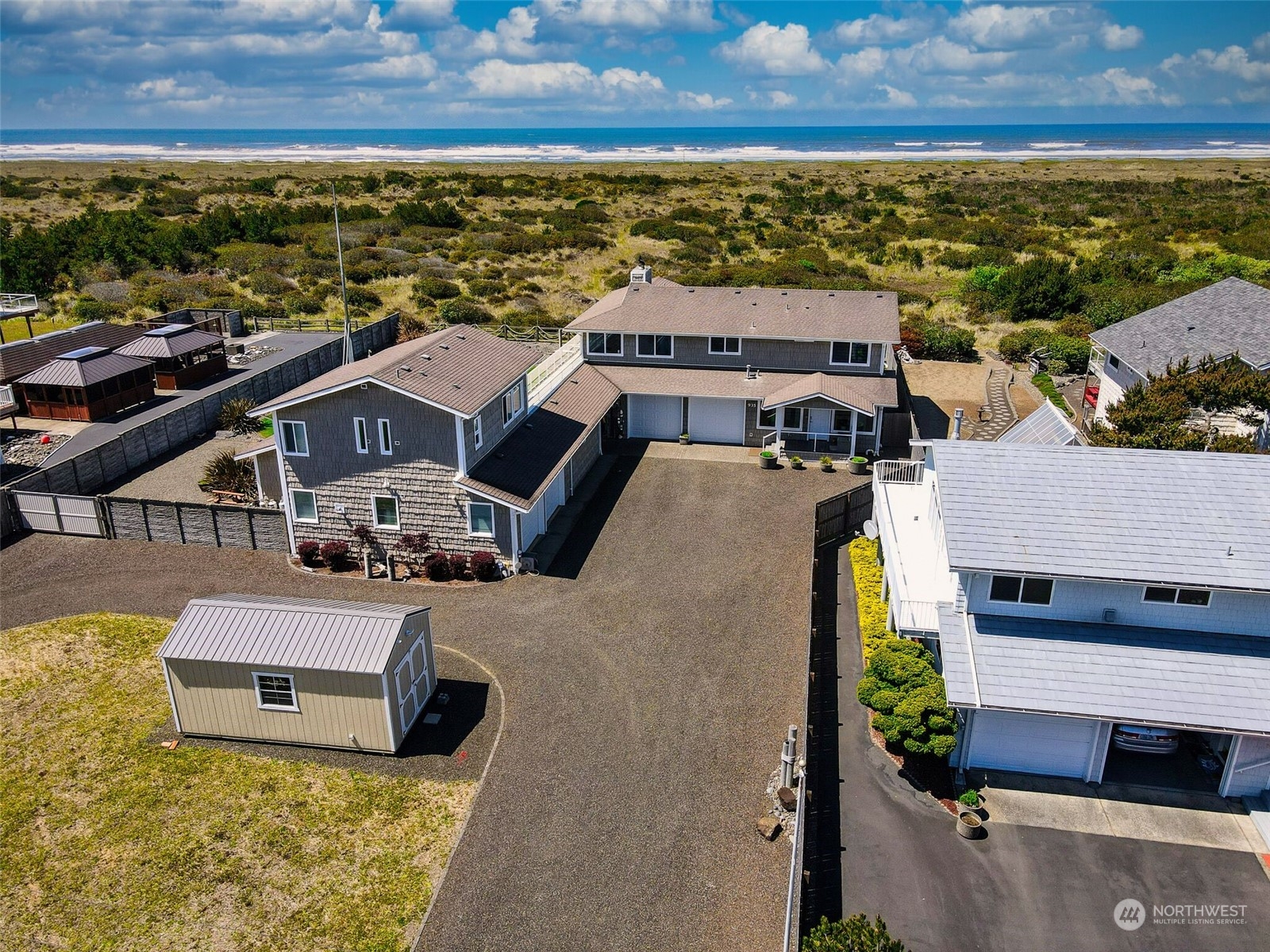 an aerial view of a house with a ocean view