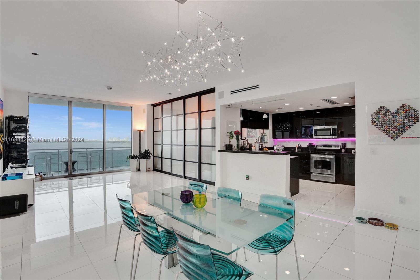 a kitchen with stainless steel appliances kitchen island granite countertop a sink and cabinets