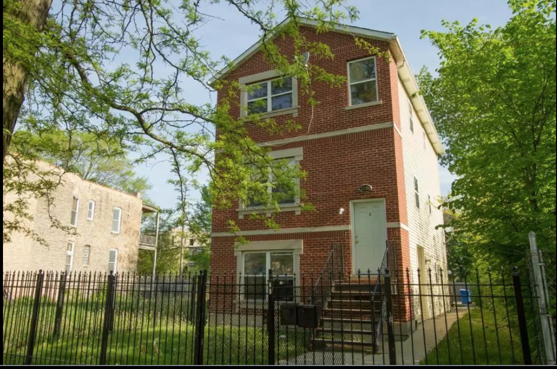 front view of a house with a yard