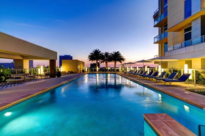 a view of swimming pool with outdoor seating