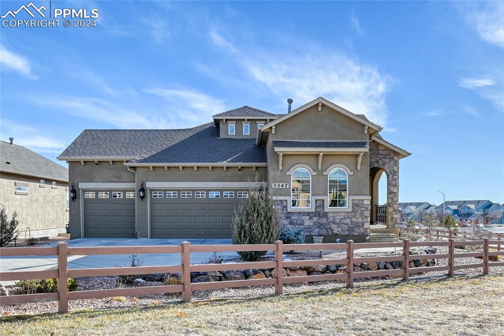 View of front facade with 3 car garage