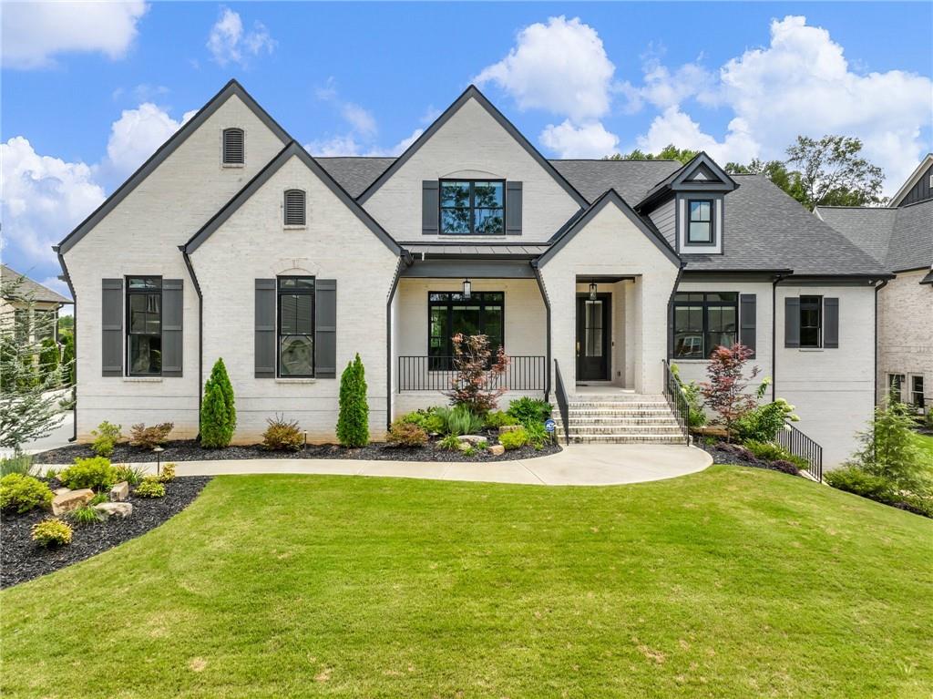 a front view of a house with a yard