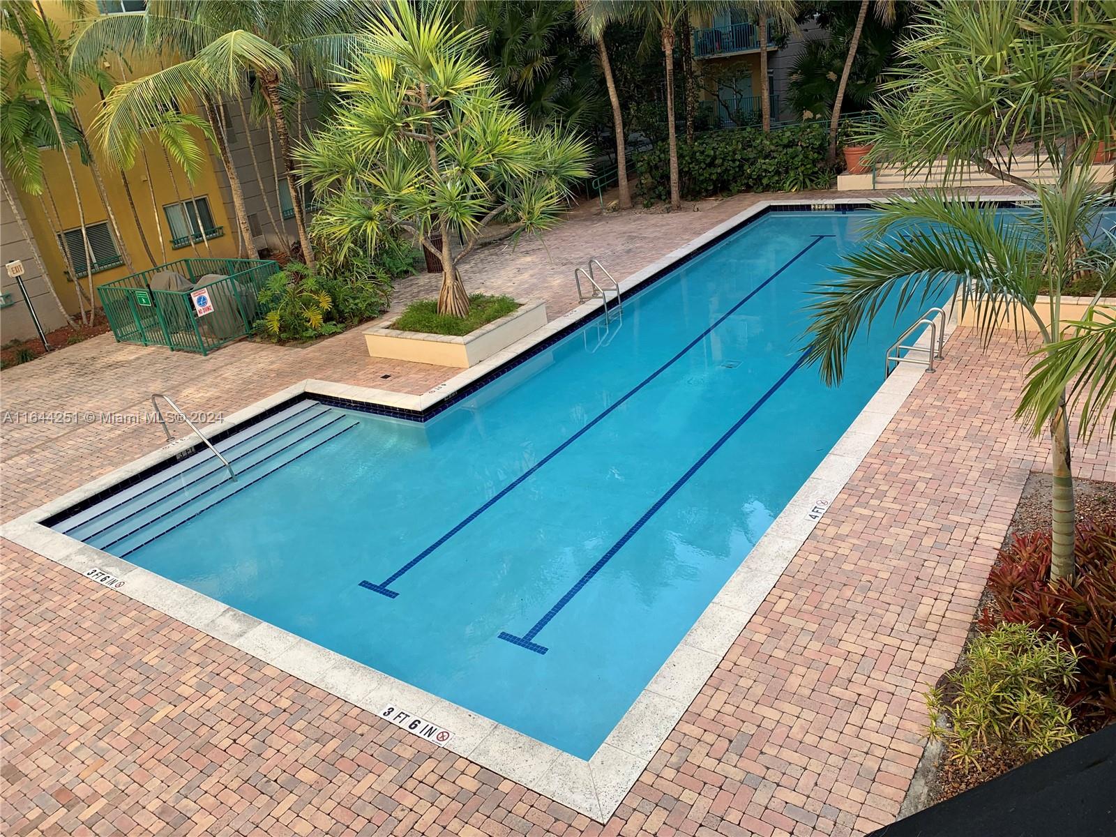 a view of swimming pool with a patio