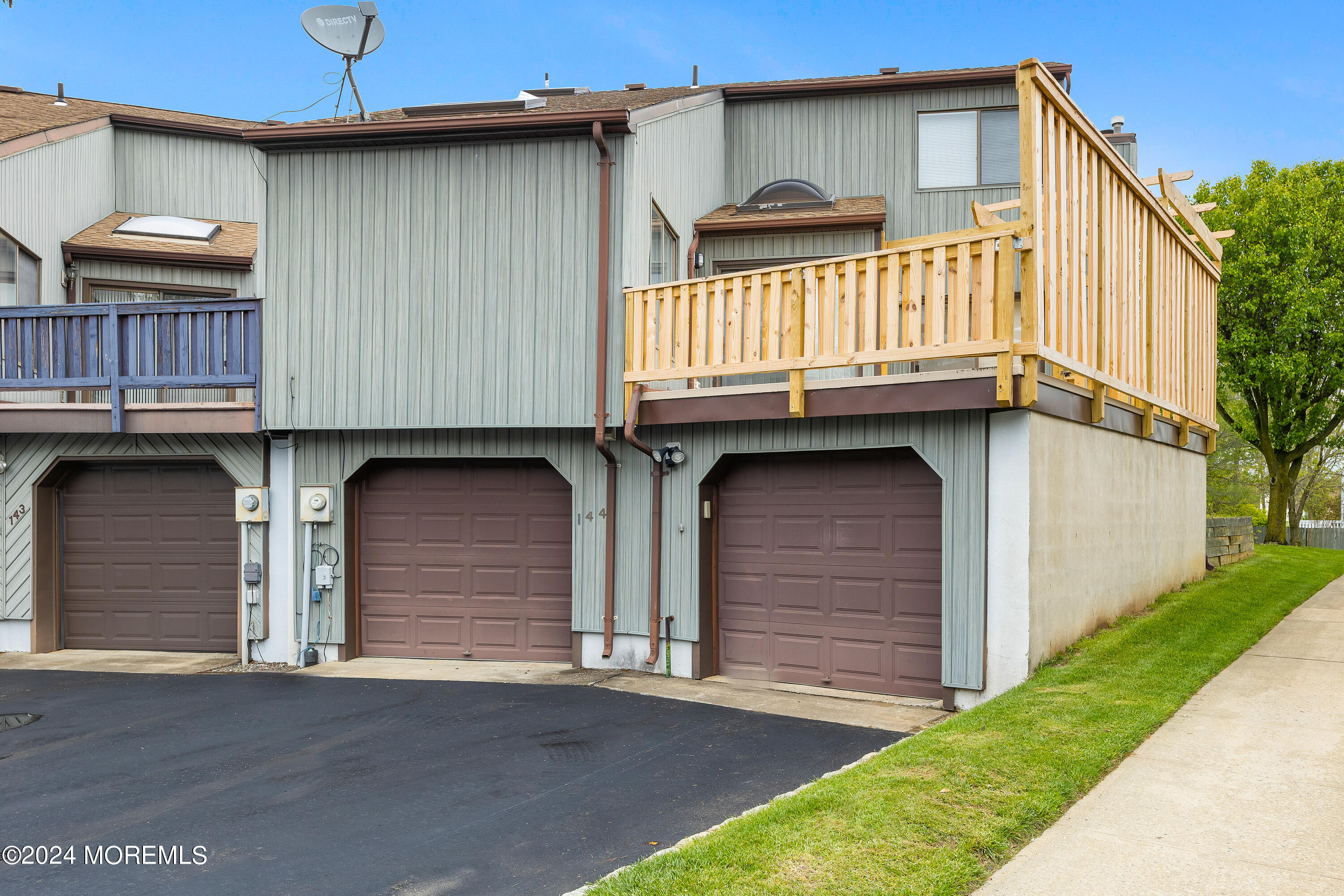 a front view of a house with garage