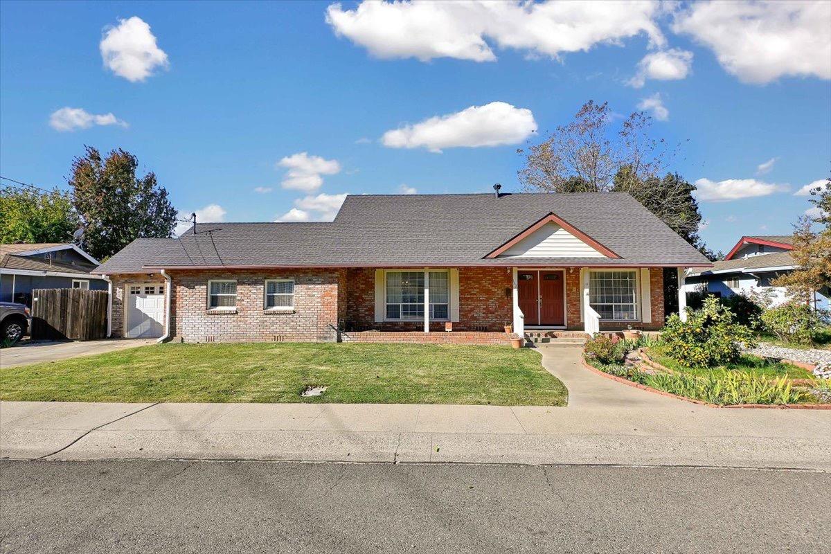 a front view of a house with a yard