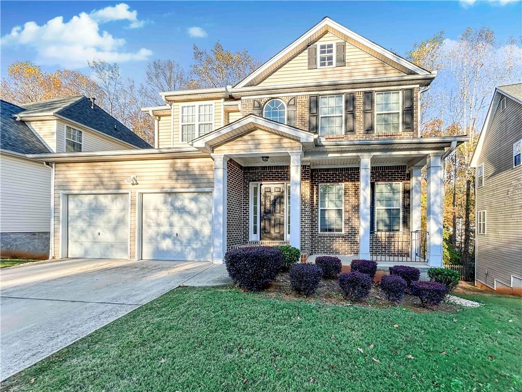 a front view of a house with a yard