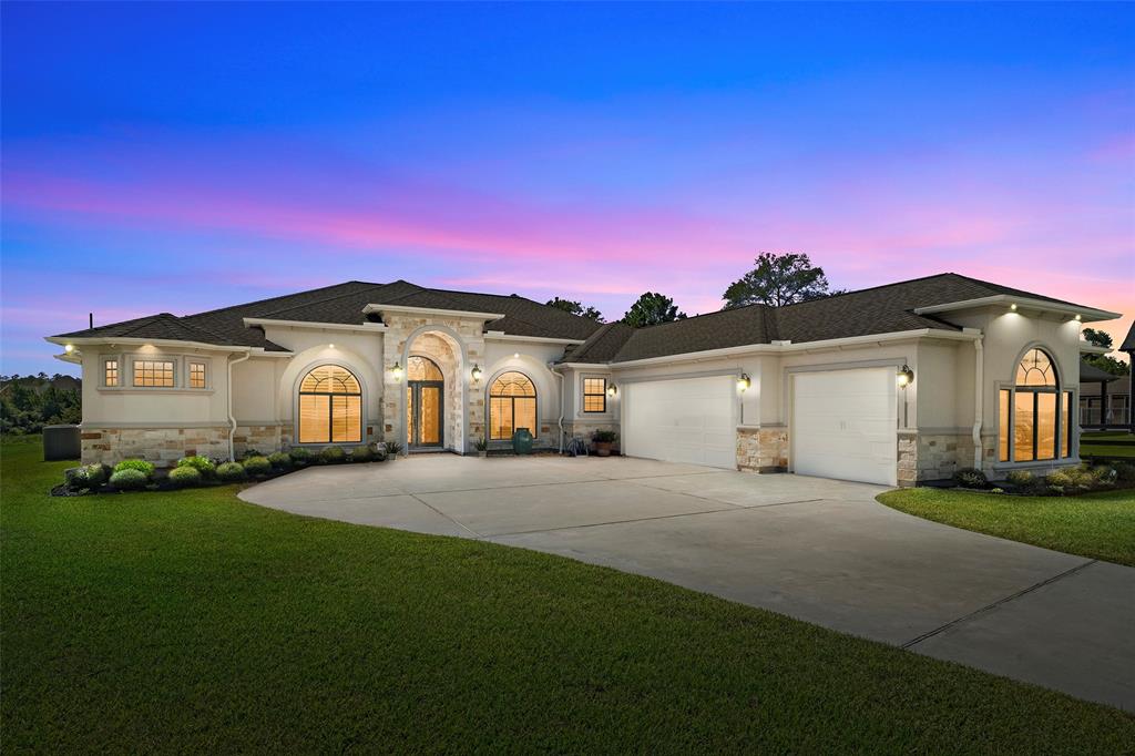 Discover the elegance of 8858 Taylor's Court, nestled in the exclusive Grand Lake Estates gated community.