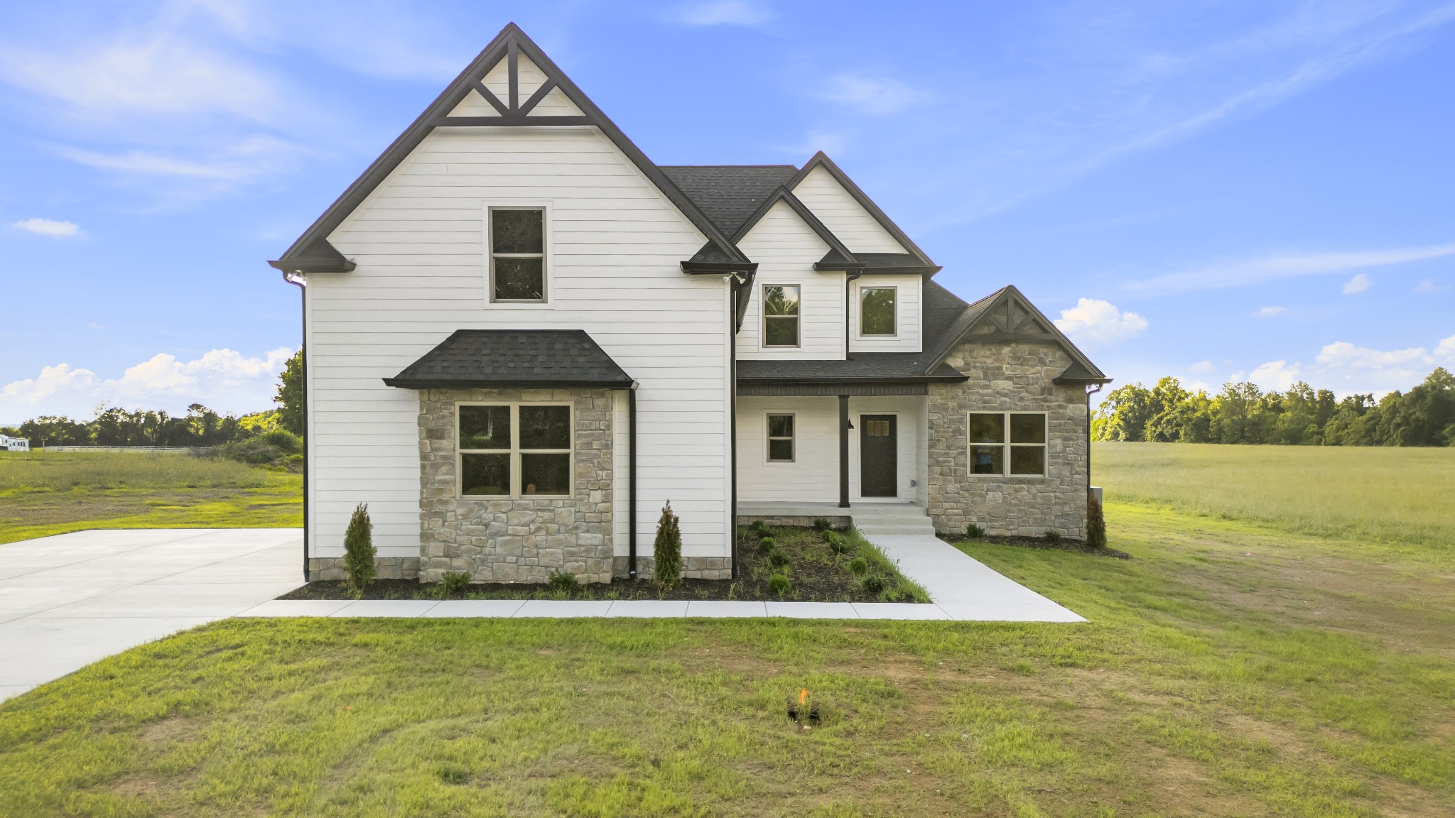 a front view of house with yard and swimming pool