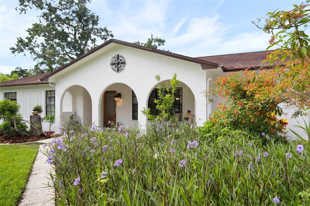 a front view of a house with garden